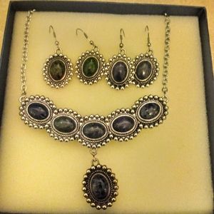 Necklace, earrings.